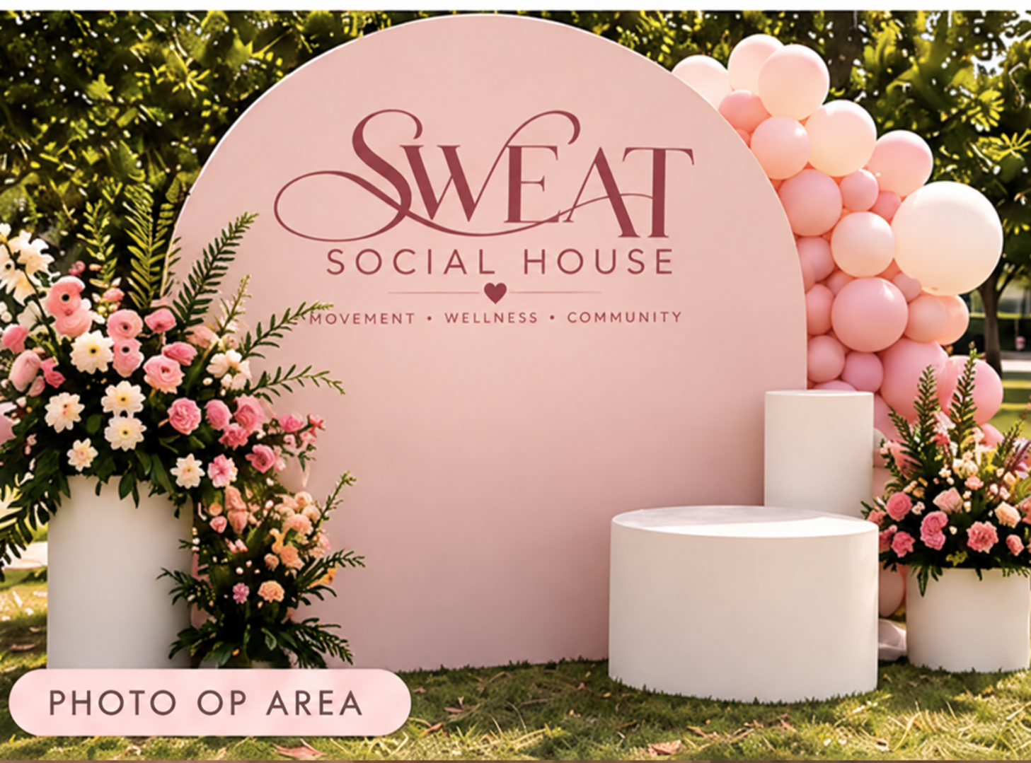 Pink photo backdrop at an outdoor fitness event
